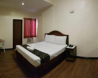 Grand Traveler Suite Inc - Manila - Habitación