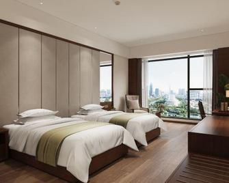 Jun Hao Sunshine Hotel - Suining - Slaapkamer