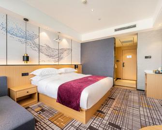 Jiugang Hotel (Jiayuguan Guancheng Fangte Phase 2 Huaboyuan) - Jiayuguan - Bedroom