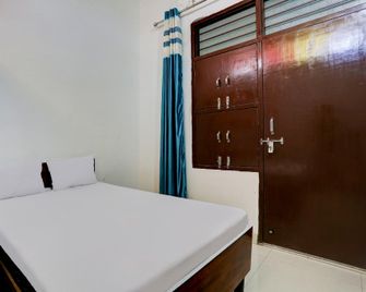 Pop OYO Hotel. - Jīnd - Bedroom