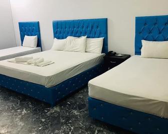 Hotel Rose Inn - Lahore - Slaapkamer