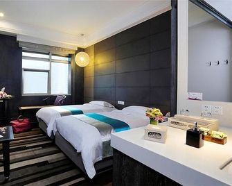 Herton Garden Hotel - Kunming - Makuuhuone