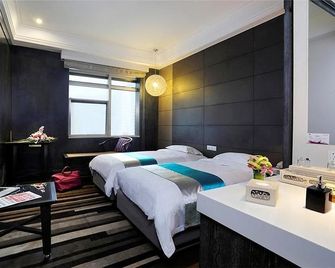 Herton Garden Hotel - קונמינג - חדר שינה