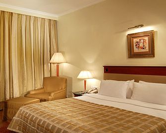 City Heart Sarovar Portico - לודיאנה - חדר שינה