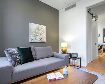 Dreamy Nolita 1BR w/ W/D, Heated Bathroom, above SoHo cafe, by Blueground - New York - Living room