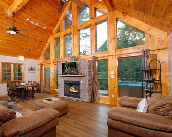 Shuffle board table, hot tub, outdoor gas firepit, smart TVs- cozy 2BR log cabin - Pigeon Forge - Living room