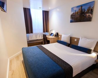 فندق لايبراري أمستردام - امستردام - غرفة نوم