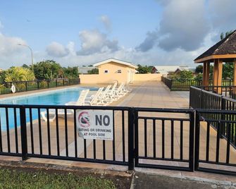 Charming family home in a serene gated community of The Crossings - Arima - Pool