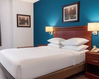 سيجنيتشر إن آند سويتس هاميلتون - هاميلتون - غرفة نوم