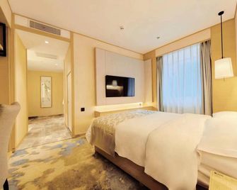 Oriental Pearl International Hotel - Mudanjiang - Schlafzimmer