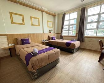Take Guesthouse 1 - Jambi - Camera da letto