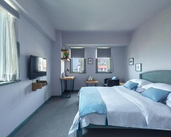 Chongqing Hairongyisheng Hotel - تشونغتشينغ - غرفة نوم
