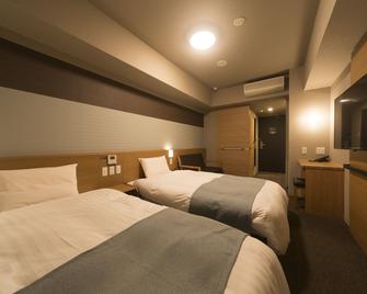 دورمي إن إيزومو - إيزومو - غرفة نوم