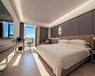 Yangguang Express Hotel - Xiangxi - Bedroom