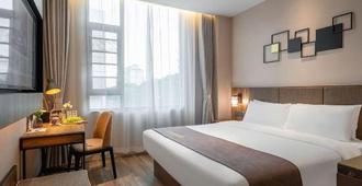 Home Inn Plus Hotel (Xiamen Jimei University Branch) - Xiamen - Slaapkamer
