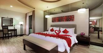 Aston Pontianak Hotel And Convention Center - Pontianak - Bedroom