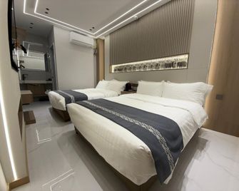Jinbo Yiwan Business Hotel - Jinzhou - Camera da letto