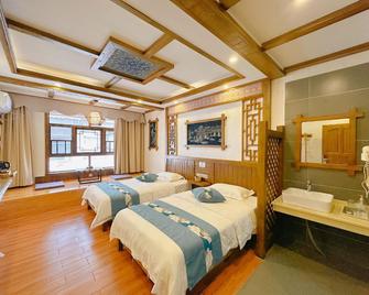 Zhangjiajie Qianshanju Inn - ג'אנגג'יאיי - חדר שינה