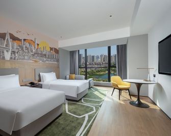 홀리데이 인 호텔 앤드 스위트 충칭 난안 바이 IHG - 충칭 - 침실