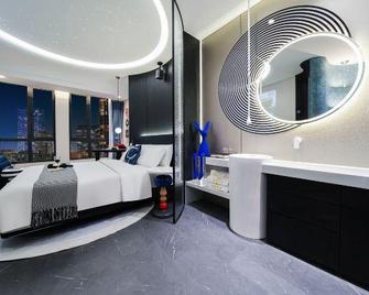 Haodi Hotel (Chongqing Huangnibang Light Rail Station) - Chongqing - Habitación