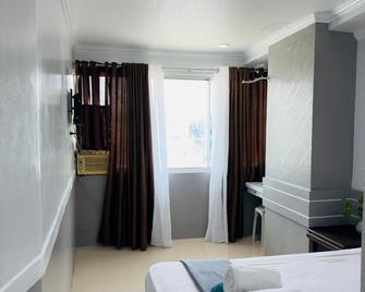 D' Abirus Inn - Davao City - Schlafzimmer