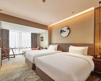 Dong Fang Hotel Guangzhou - גואנגג'ואו - חדר שינה