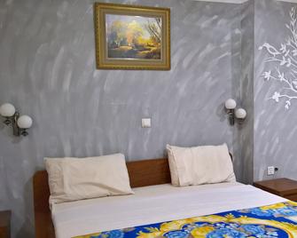 أوتيل بور فو - كينشاسا - غرفة نوم