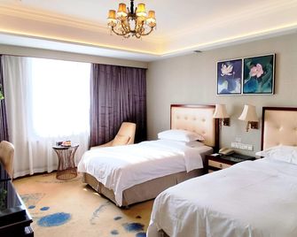 Ramada Plaza by Wyndham Tian Lu Hotel Wuhan - Wuhan - Schlafzimmer