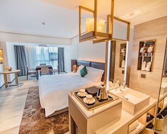 Echarm Plus Hotel Xiangyang Minfa Century New Town - Xiangfan - Slaapkamer