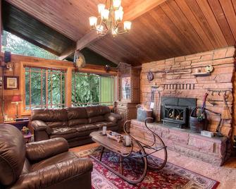Cedar-Stone River House: Cozy & Whimsical W/ Hot Tub Under Towering Mountains - Gold Bar - Living room