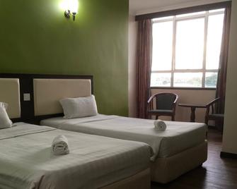 Disini Hotel - Kota Kinabalu - Bedroom