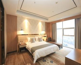 Greentree Eastern Bengbu City Guzhen County Century Hotel - Bengbu - Schlafzimmer