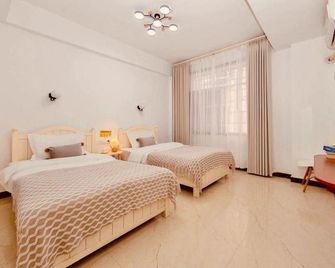 Zhangjiajie 26 Degree Theme Hostel - Zhangjiajie - Schlafzimmer