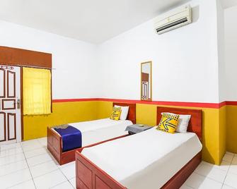 OYO 90194 Wisma Ria - Lubuklinggau - Habitación
