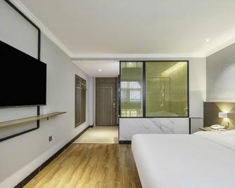 7 Days Inn Liaocheng Xiang Jiang Motor Station Branch - Liaocheng - Slaapkamer