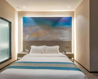 Haidi Youshe Boutique Hotel (Qingdao May 4th Square Olympic Sailing Center Branch) - Qingdao - Bedroom