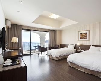 Songjung Hotel - Busan - Schlafzimmer