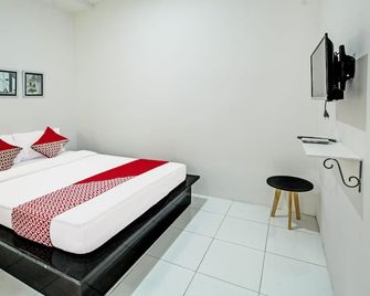 호텔 O 시리 가딩 패밀리 게스트 하우스 - 똘릉아궁 - 침실