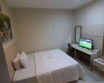 Galaxy Inn - Baubau - Bedroom
