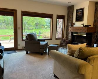 Centrally located condo with furnished deck, amazing Teton views, & fireplace - Moose - Living room