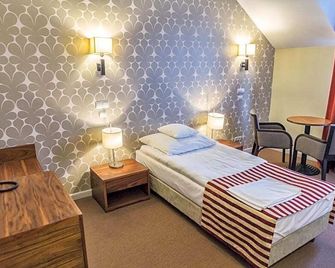 Hotel Lord Krosno - كروسنو - غرفة نوم