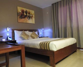 Venus Premier Hotel - ארושה - חדר שינה