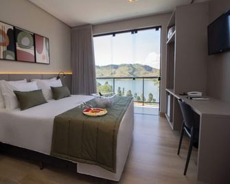 Bellville Pousada - Capitólio - Schlafzimmer