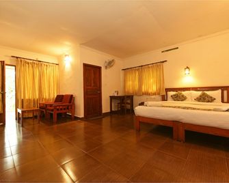 جلينمور ريزورتس - مونار - غرفة نوم