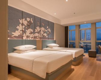 Magnotel Classic (Jiaozuo Yuandai Times Shopping Center) - Jiaozuo - Slaapkamer