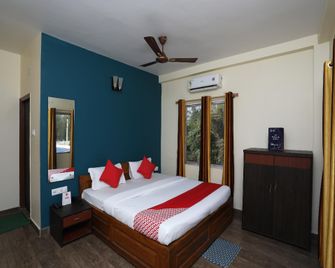 OYO 22622 Dolphin Beach Resort - Mandarmani - Спальня