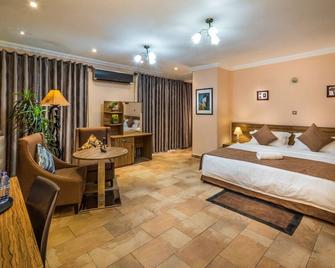 Midindi Hotel - Accra - Schlafzimmer