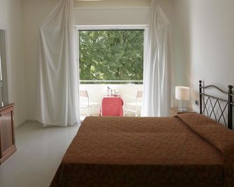 هوتل سوريسو - البندقية - غرفة نوم