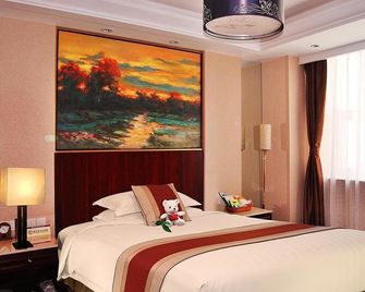 Yizheng Hotel - ז'ינאן - חדר שינה