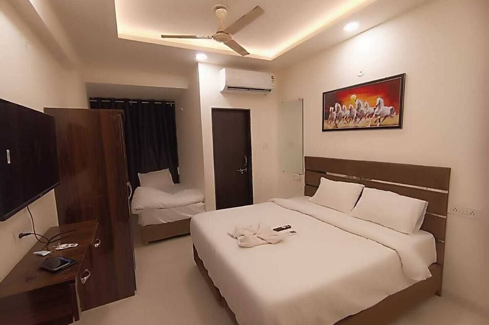 Hotel Kiwi Inn Vijaynagar Scheme 78 - אינדור - חדר שינה
